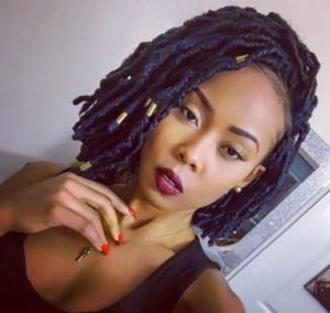 navy blue faux locs with gold beads
