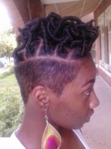 short faux locs with shaved side