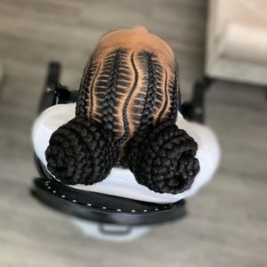 Stitch Braids Double Buns With Curved Part