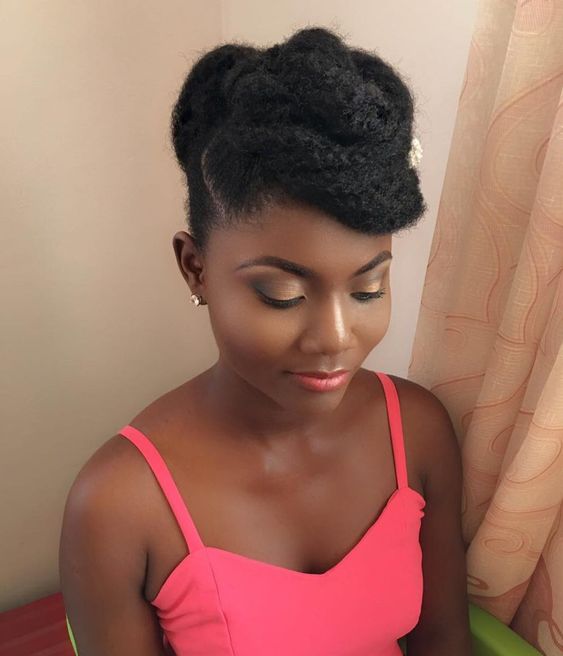 formal updo with blow dried afro hair