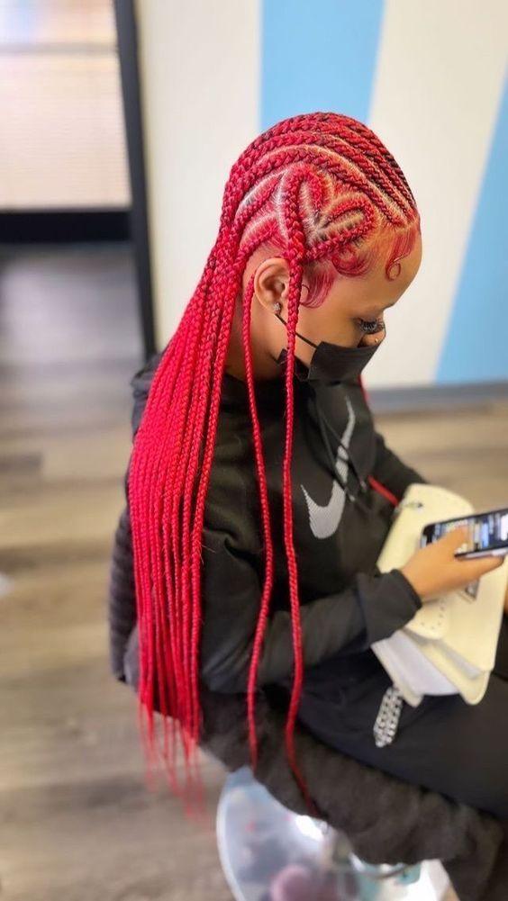 red feed in braids with heart