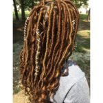 goddess locs with goldern highlights