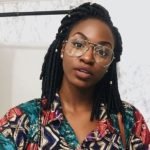 half pinned back faux locs with beads