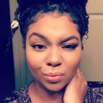 high bun with cowrie shells goddess locs