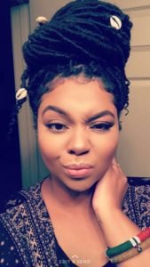 high bun with cowrie shells goddess locs