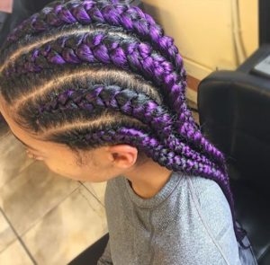 purple streaked feed in braids