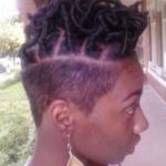 short faux locs with shaved side