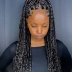 black rubber band braids in ponytail