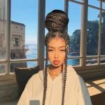 jumbo rubber band box braids in a big bun