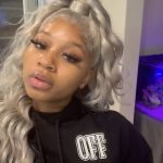 grey half up half down sew in with curls