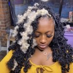 fluffy butterfly locs with blonde streaks