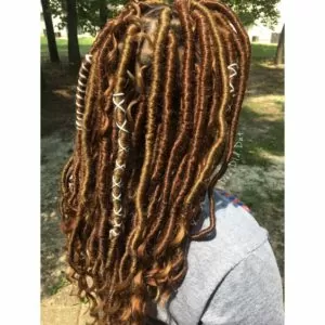 goddess locs with goldern highlights