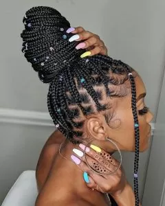 rubber band box braids in a bun with colorful beads