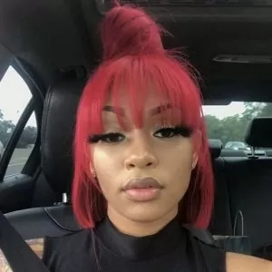 dark red half up half down sew in with bun and bangs