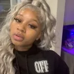 grey half up half down sew in with curls