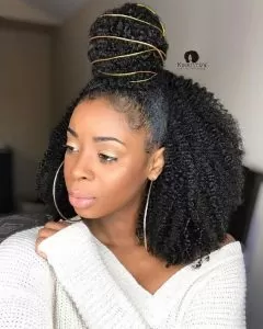 half up half down bun with baby hair