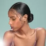 middle part low bun with long baby hair