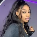 wavy half up half down sew in with dangling front pieces